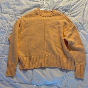 creamsicle colored stitch detailed sweater
